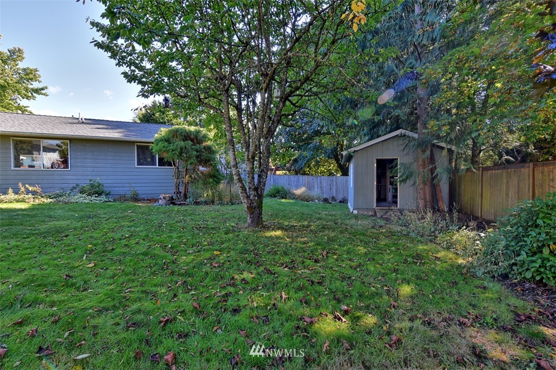 2417 171st Street Southeast Bothell, WA 98012 - Photo 18 of 18 a view of a house with yard and tree s