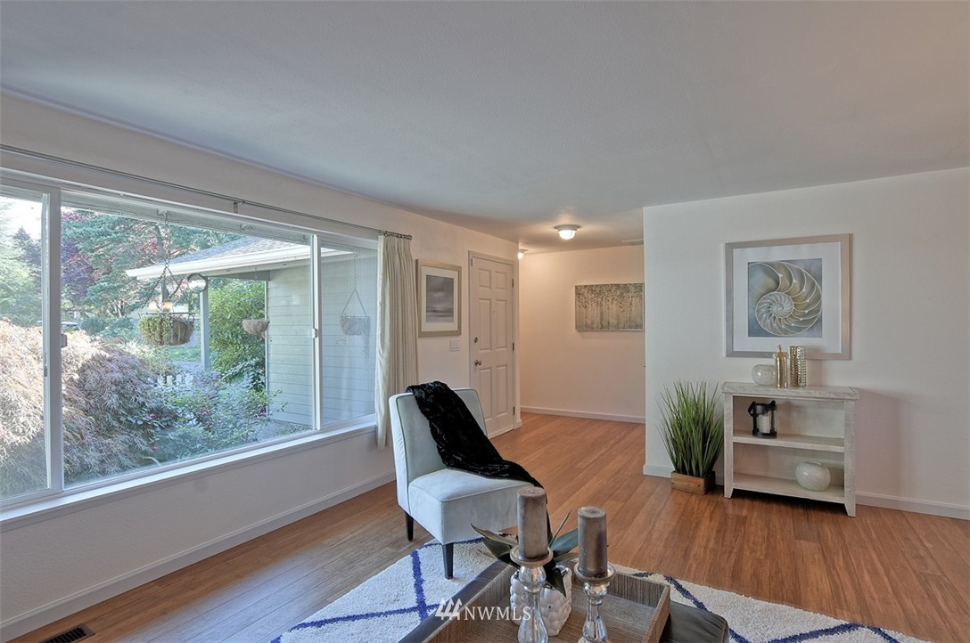 2417 171st Street Southeast Bothell, WA 98012 - Photo 6 of 18 a workspace with furniture window and wooden floor