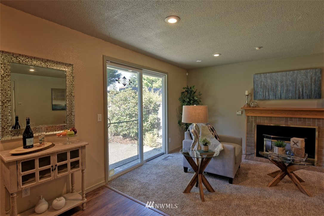 2417 171st Street Southeast Bothell, WA 98012 - Photo 10 of 18 a living room with furniture and a fireplace