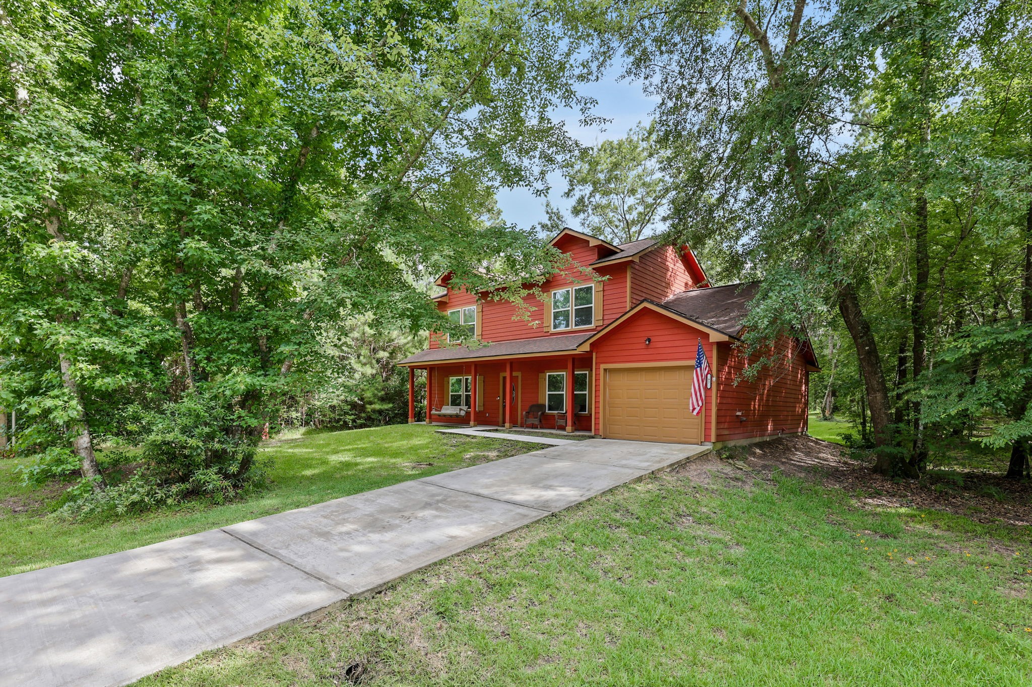 97 Harrell Road Coldspring, TX 77331 - Photo 28 of 31 The one car garage provides room for storage and there is good driveway parking for additional vehicles