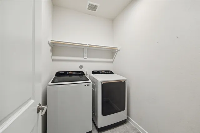 an empty room with windows and entrance