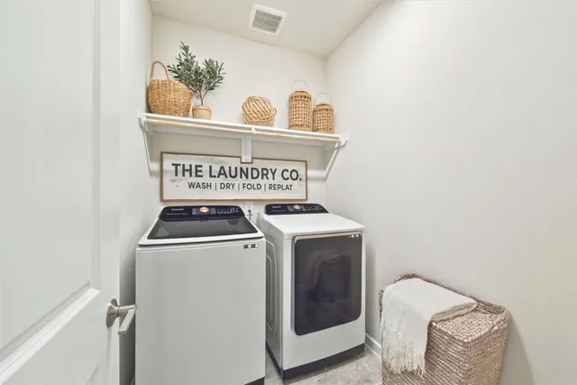 a spacious bathroom with a shower sink and mirror