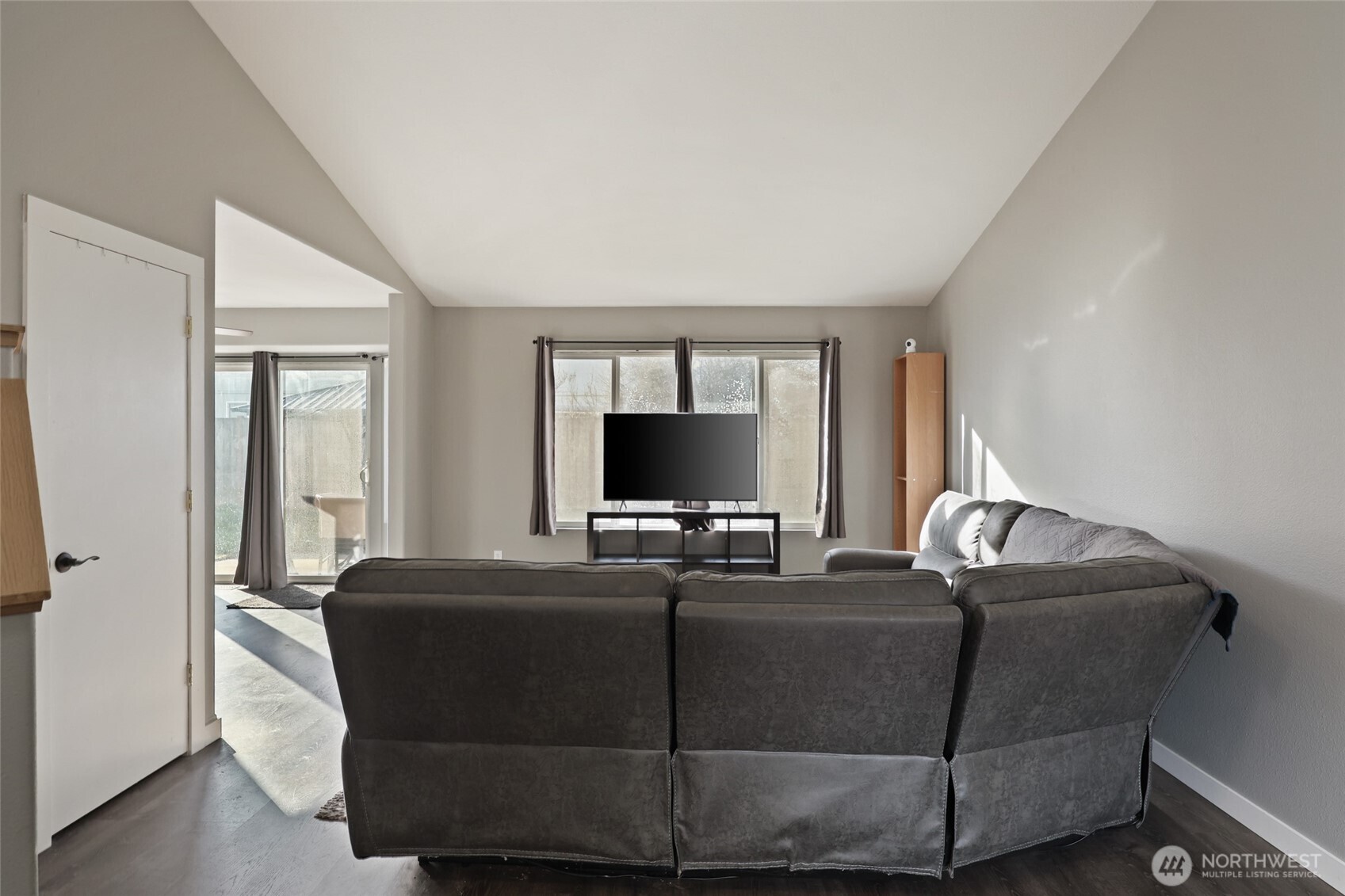 9826 Greenleaf Loop Southeast Yelm, WA 98597 - Photo 11 of 36 a living room with a couch and a flat screen tv