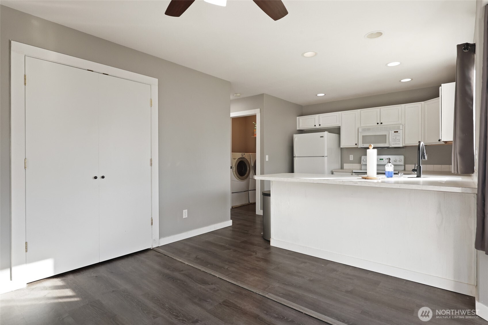 9826 Greenleaf Loop Southeast Yelm, WA 98597 - Photo 12 of 36 a kitchen with stainless steel appliances granite countertop a refrigerator and a sink