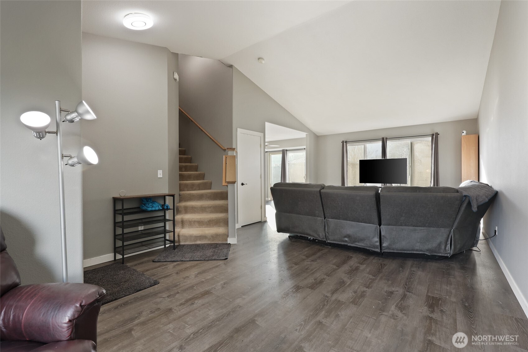 9826 Greenleaf Loop Southeast Yelm, WA 98597 - Photo 3 of 36 a living room with furniture and a flat screen tv