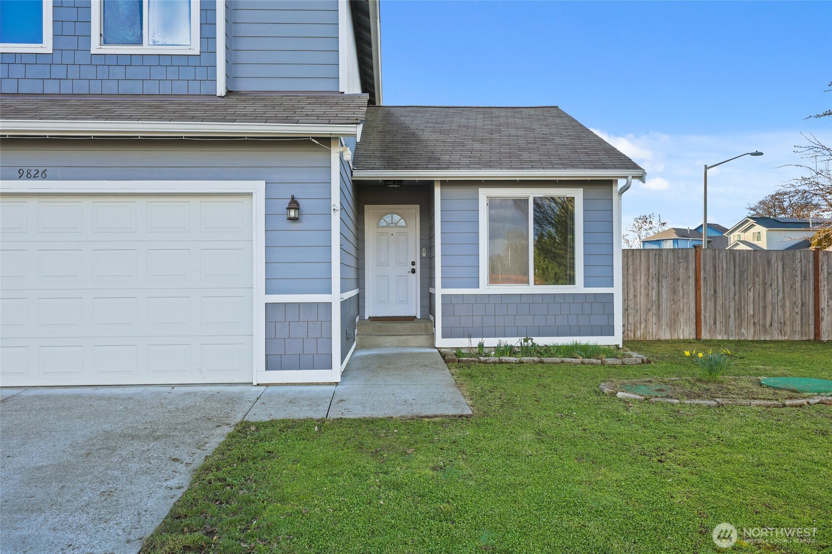 9826 Greenleaf Loop Southeast Yelm, WA 98597 - Photo 32 of 36 a front view of a house with a yard