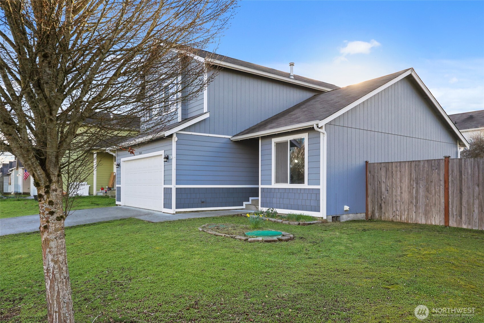 9826 Greenleaf Loop Southeast Yelm, WA 98597 - Photo 34 of 36 a backyard of a house with lots of green space