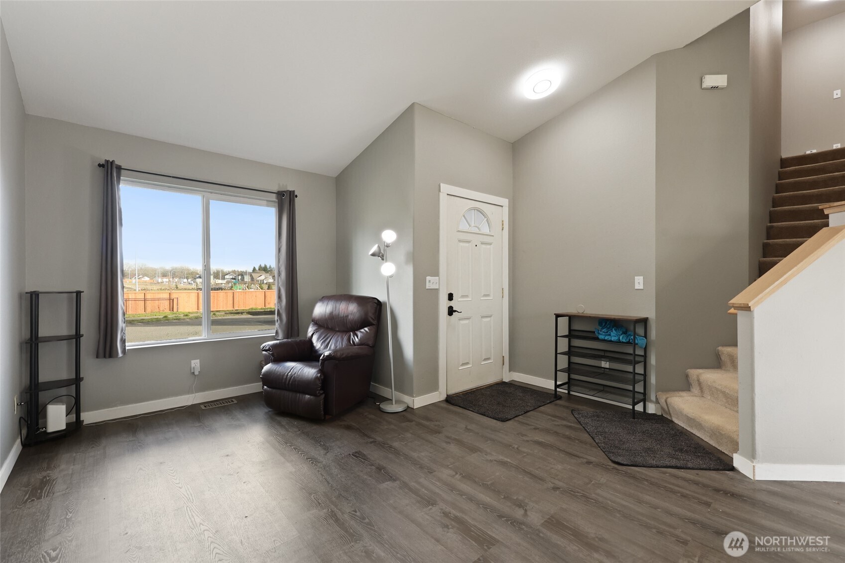 9826 Greenleaf Loop Southeast Yelm, WA 98597 - Photo 4 of 36 wooden floor and windows in a room