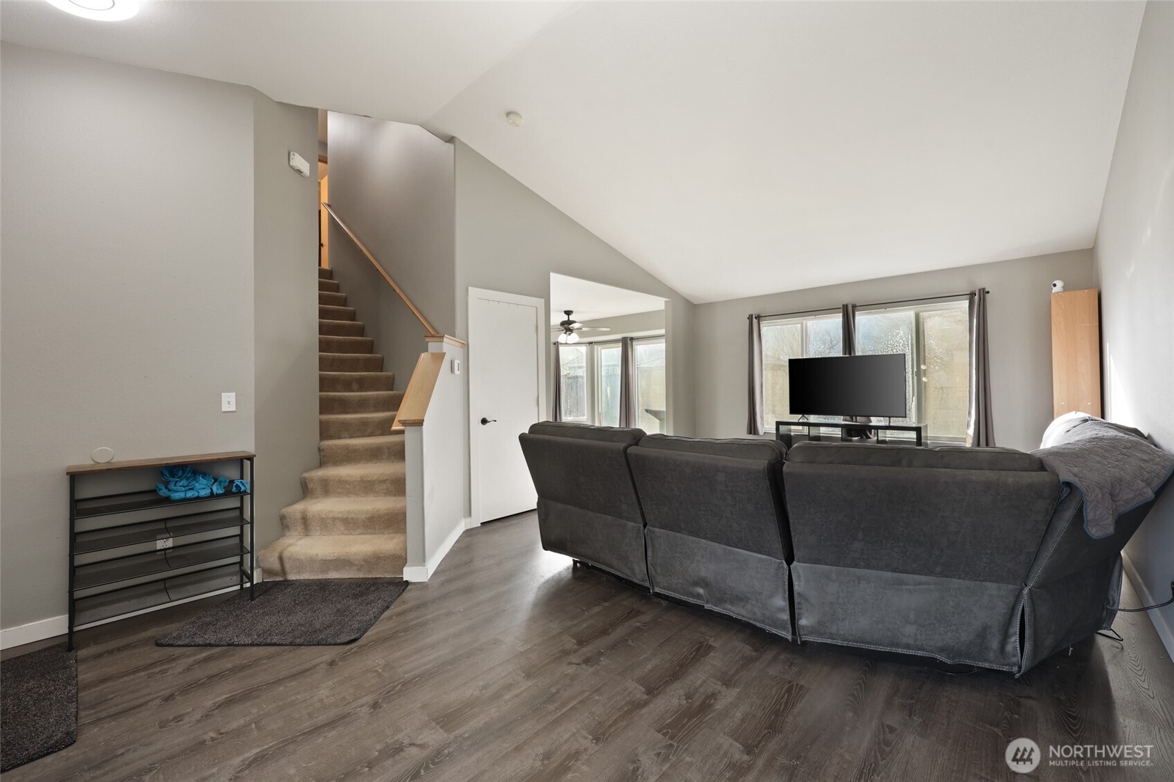 9826 Greenleaf Loop Southeast Yelm, WA 98597 - Photo 5 of 36 a living room with furniture and a flat screen tv