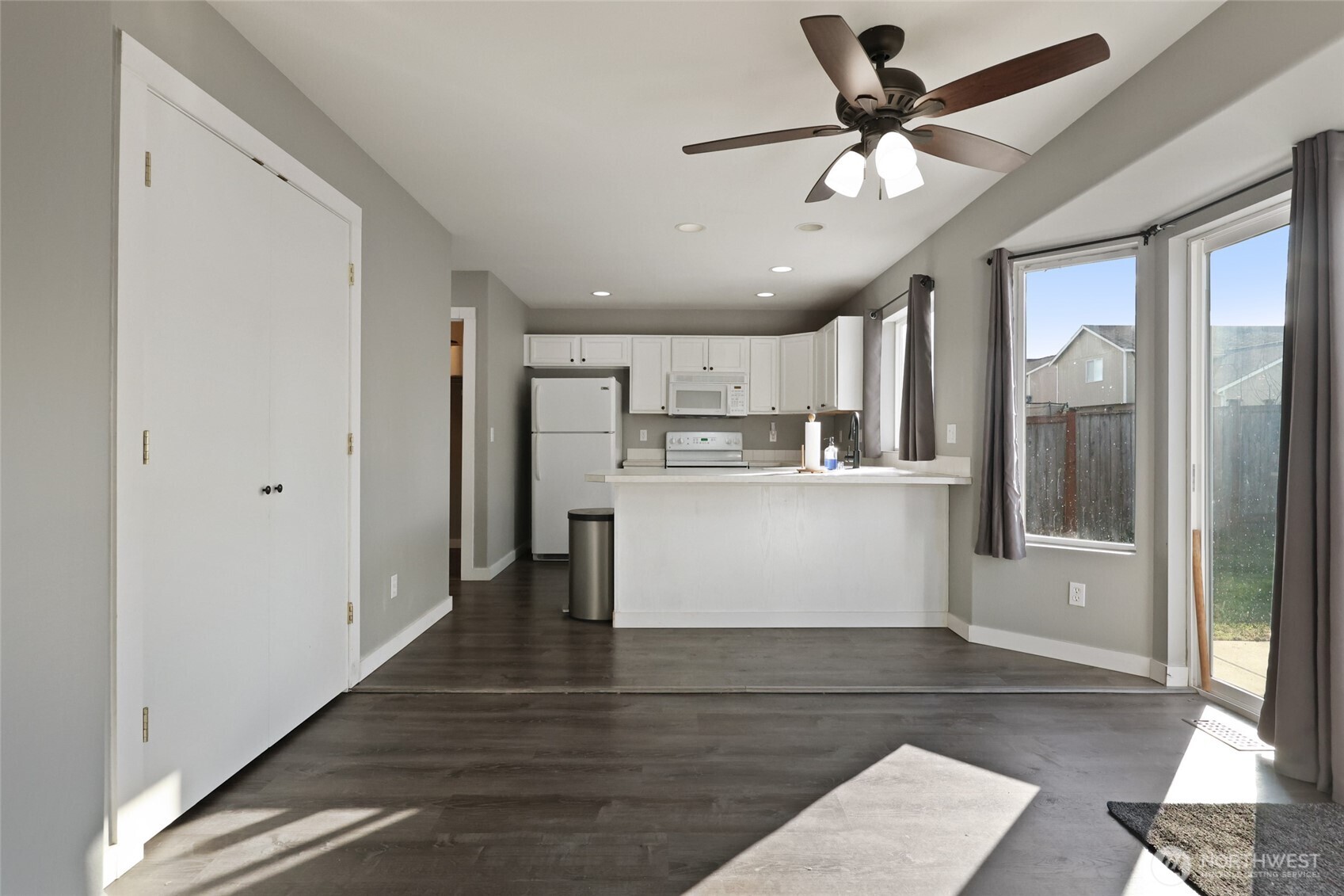 9826 Greenleaf Loop Southeast Yelm, WA 98597 - Photo 6 of 36 a view of kitchen with stainless steel appliances refrigerator oven and cabinets