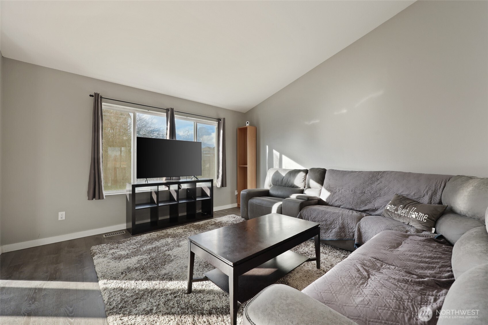 9826 Greenleaf Loop Southeast Yelm, WA 98597 - Photo 7 of 36 a living room with furniture and a flat screen tv