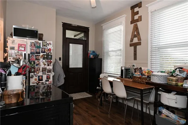 a view of a dining room with furniture and window