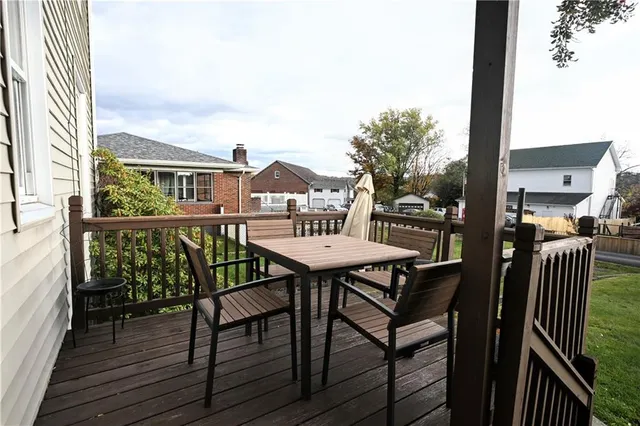 a view of a chairs and table on the deck