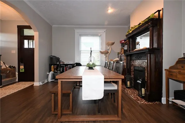 a dining room with furniture and window