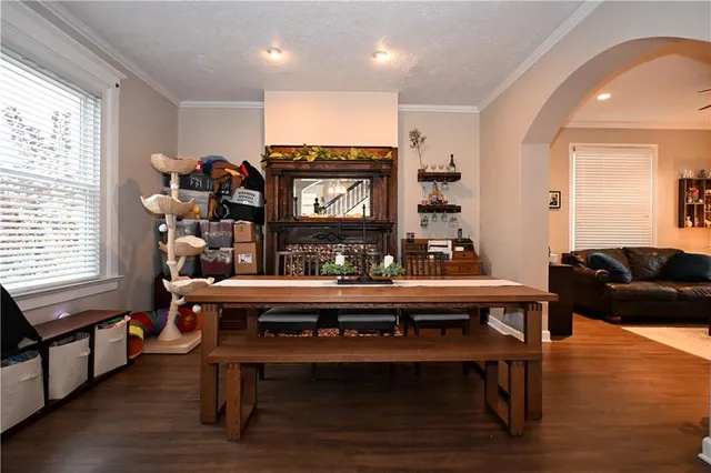 a living room with furniture a rug and a fireplace