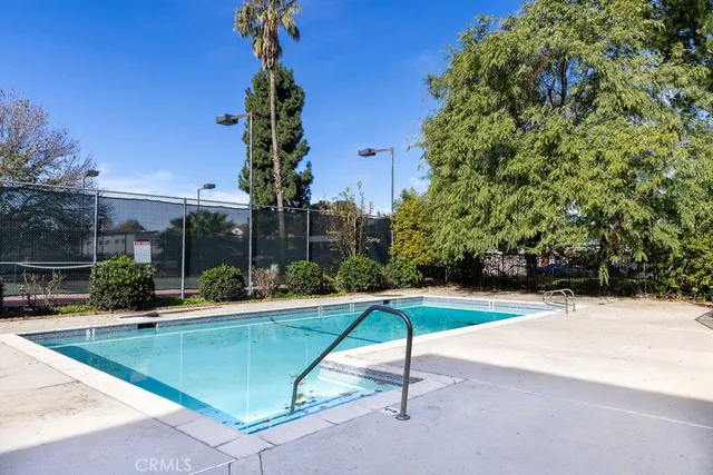 a view of backyard with trampoline