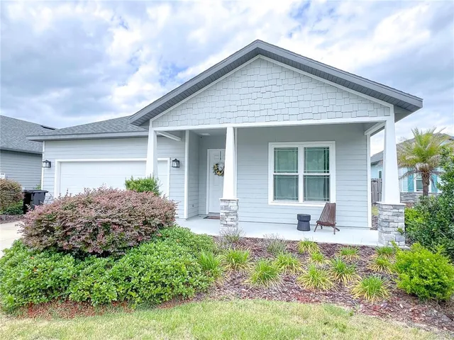 a front view of house with yard and seating space