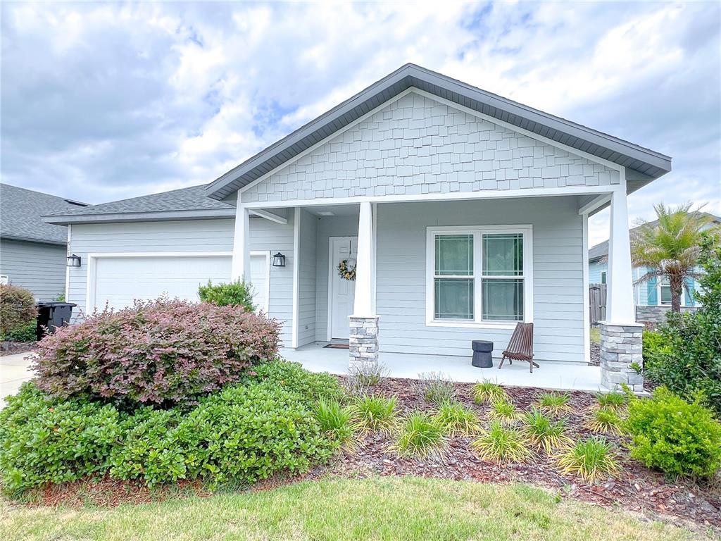a front view of house with yard and seating space