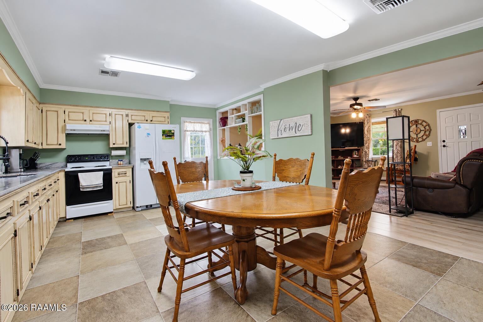 2685 Lloyd Road Maurice, LA 70555 - Photo 8 of 19 Bright Farmhouse Kitchen and Dining Area