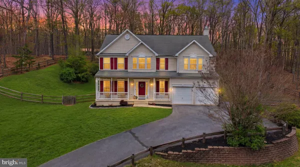 a aerial view of a house with a yard