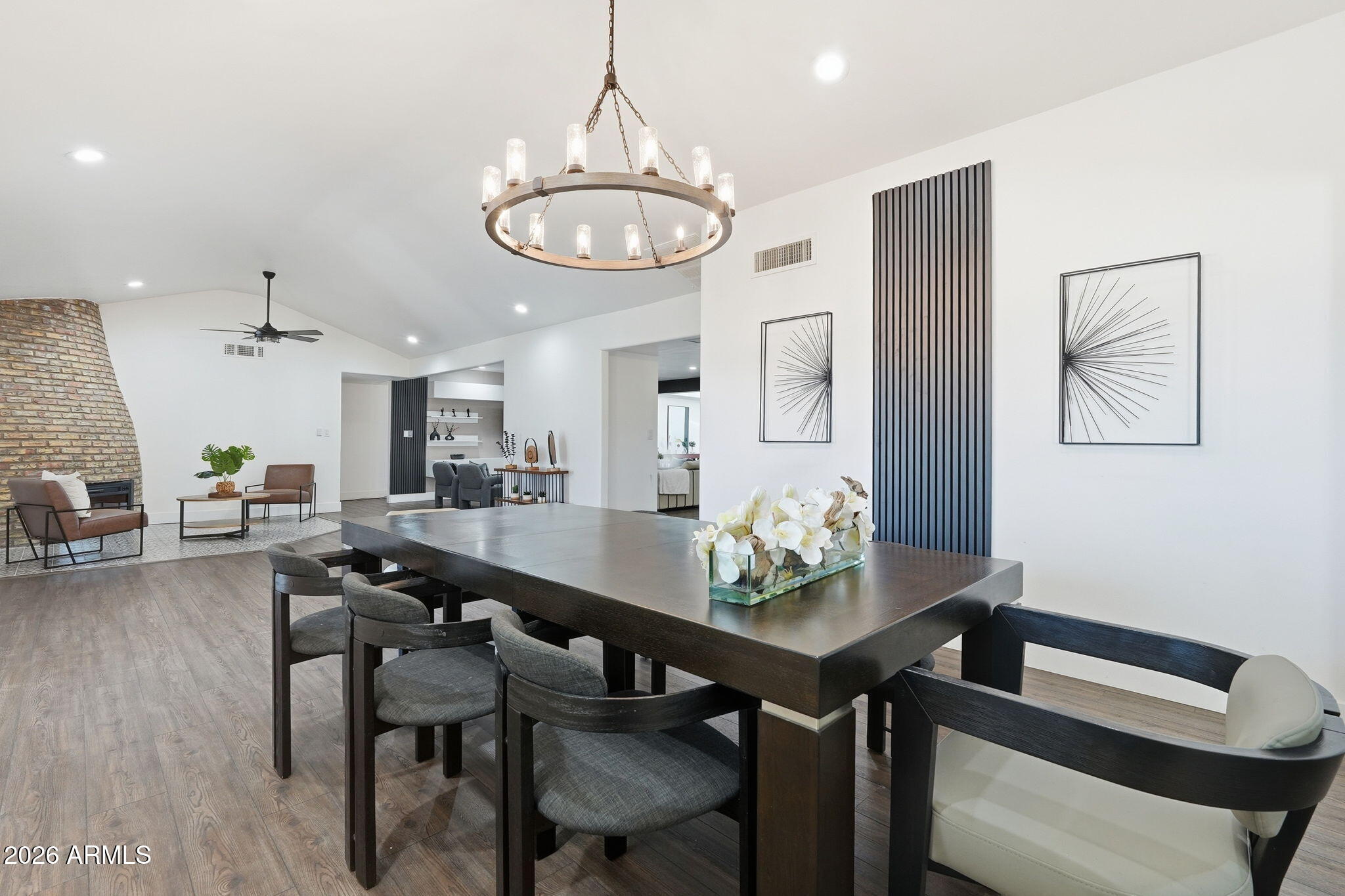 5009 East Wethersfield Road Scottsdale, AZ 85254 - Photo 18 of 30 a view of a dining room with furniture and chandelier