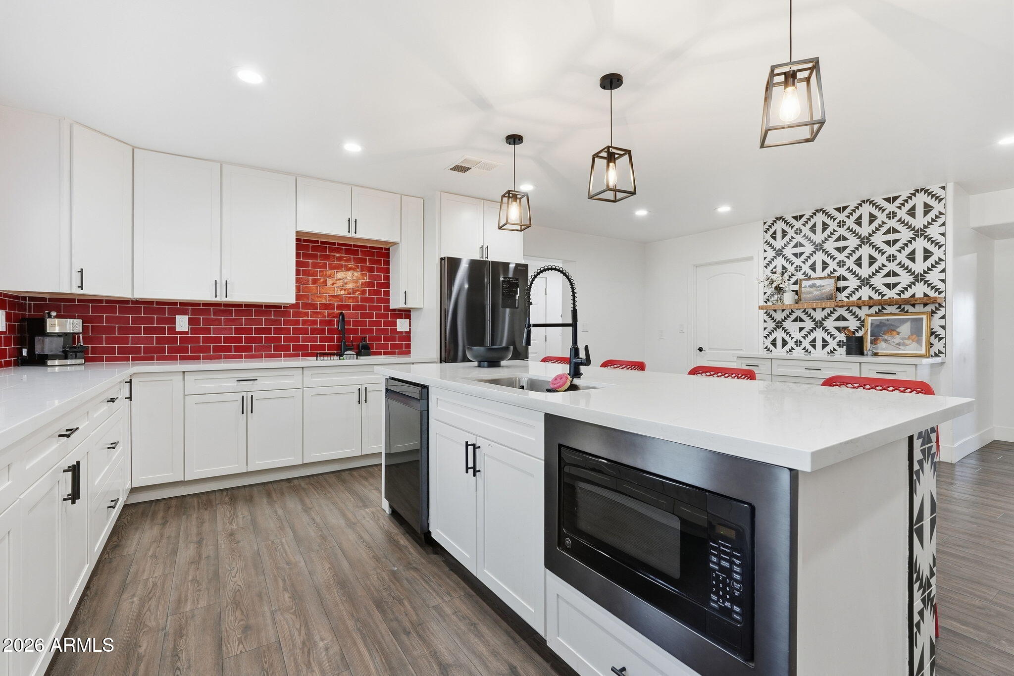 5009 East Wethersfield Road Scottsdale, AZ 85254 - Photo 19 of 30 a kitchen with granite countertop a sink cabinets and stainless steel appliances