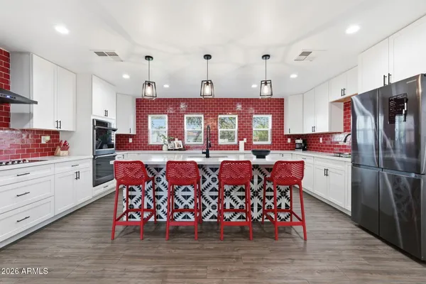 a very nice looking kitchen with a large window