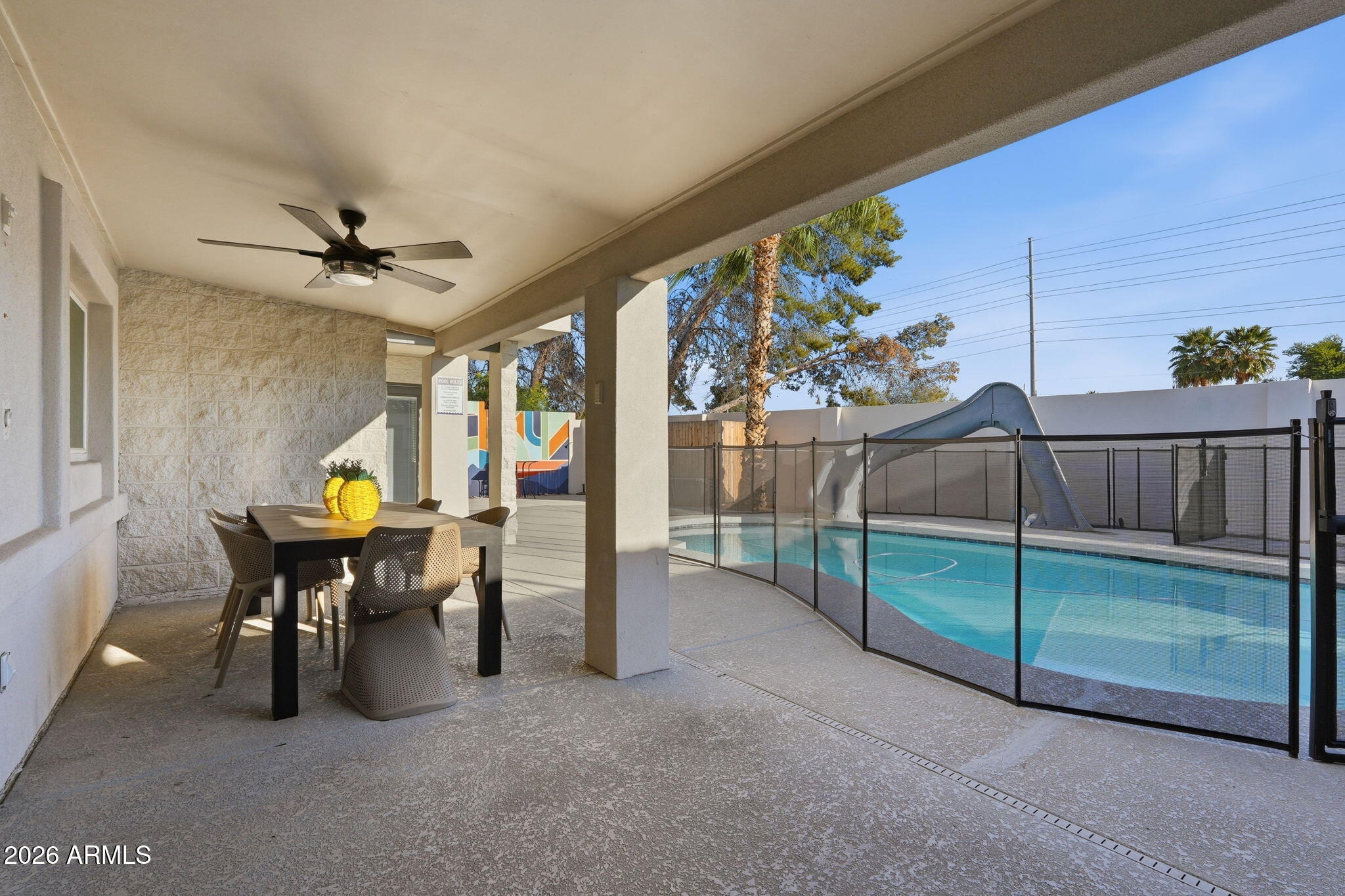 5009 East Wethersfield Road Scottsdale, AZ 85254 - Photo 24 of 30 a view of a porch with furniture