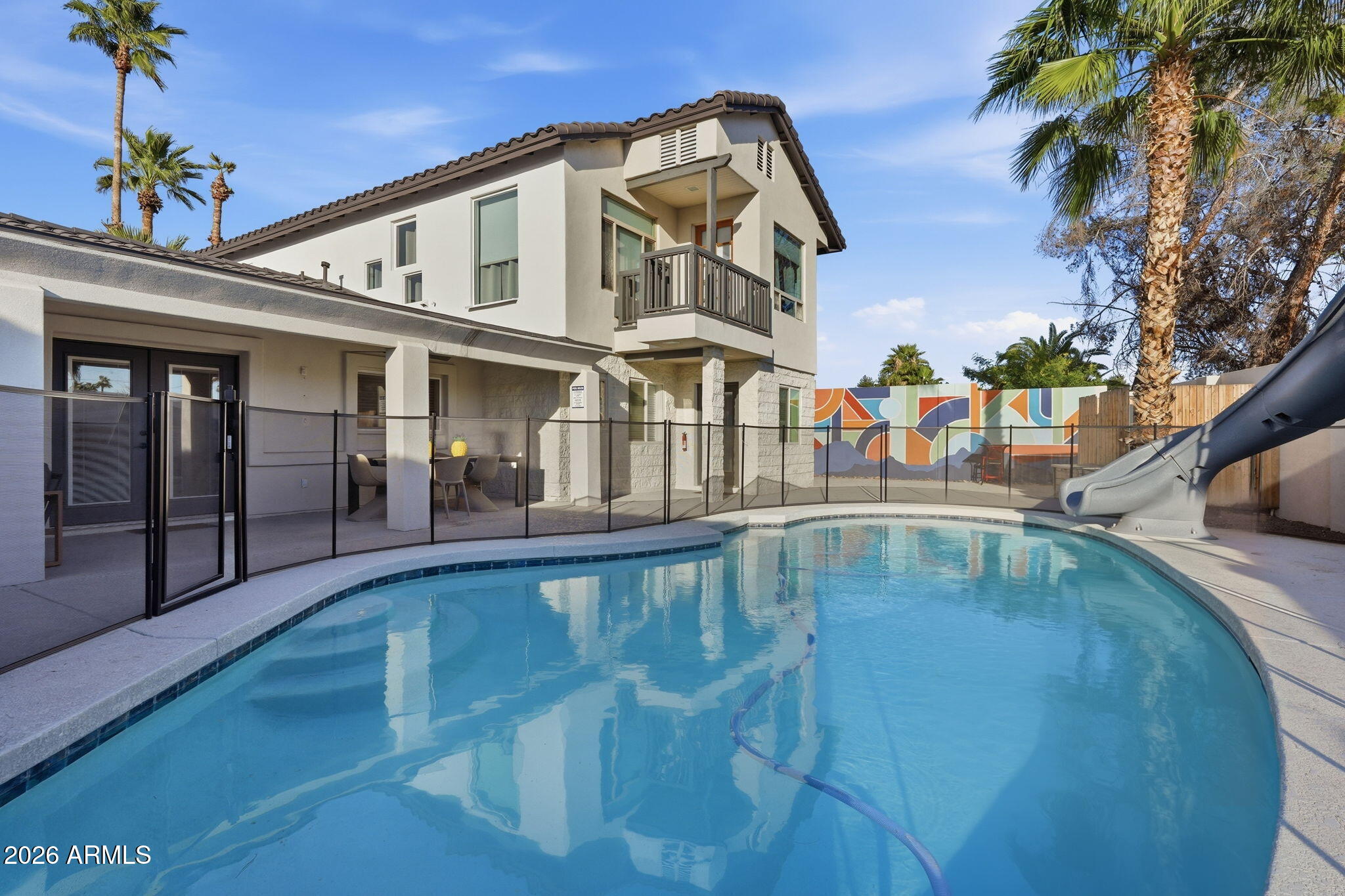5009 East Wethersfield Road Scottsdale, AZ 85254 - Photo 26 of 30 a view of a swimming pool with an outdoor seating