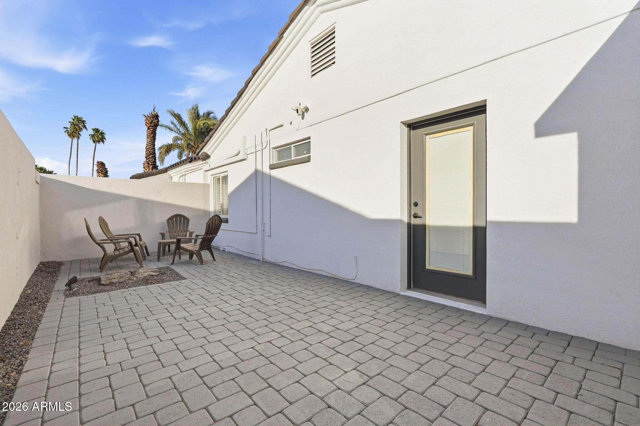5009 East Wethersfield Road Scottsdale, AZ 85254 - Photo 29 of 30 a view of a living room and entryway with a table