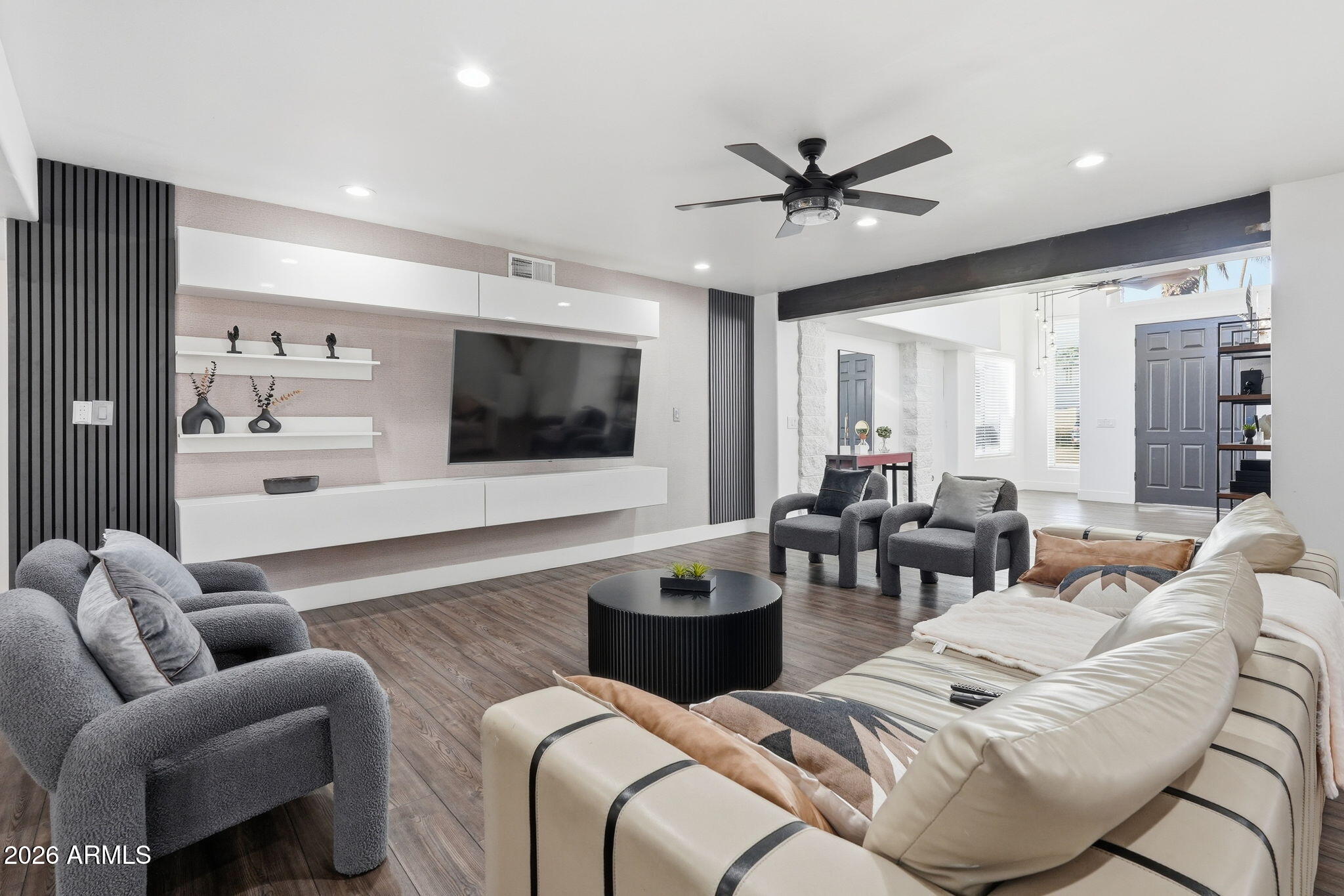 5009 East Wethersfield Road Scottsdale, AZ 85254 - Photo 6 of 30 a living room with furniture kitchen view and a flat screen tv