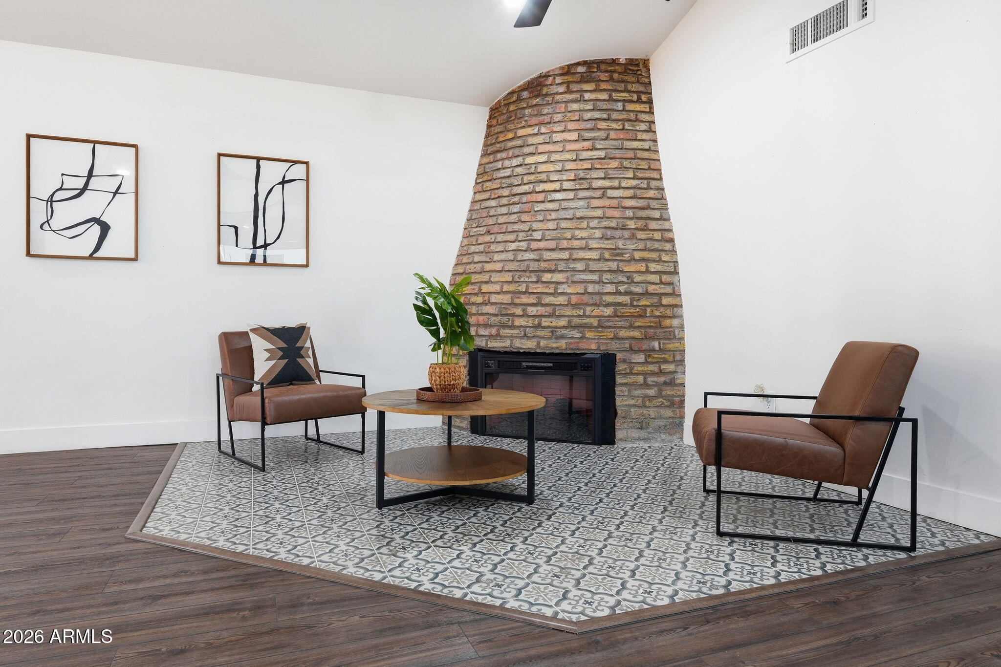 5009 East Wethersfield Road Scottsdale, AZ 85254 - Photo 8 of 30 a living room with furniture and a fireplace