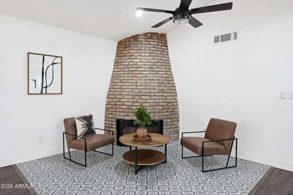 a living room with furniture and a rug