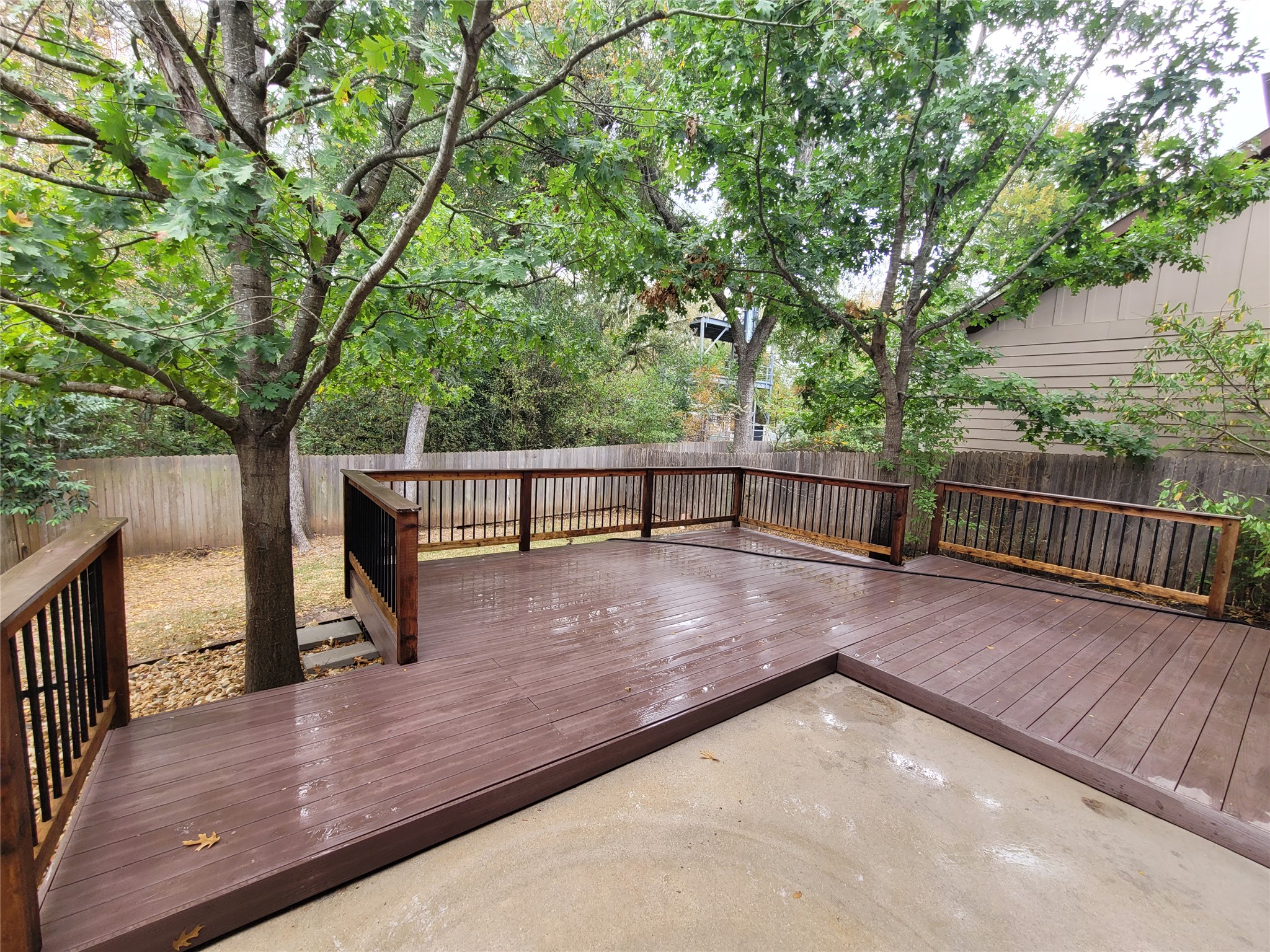 7337 Menchaca Road, Unit #22 Austin, TX 78745 - Photo 23 of 25 Wooden deck with a fenced backyard