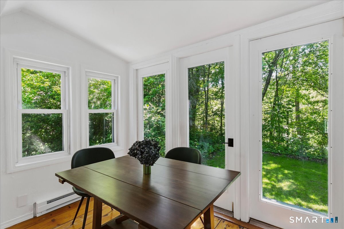 188 Bacon Road Roxbury, CT 06783 - Photo 5 of 33 a view of table and chair in room