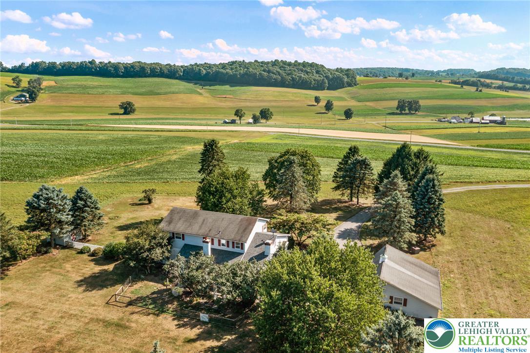 4563 Stony Ridge Road New Tripoli, PA 18066 - Photo 2 of 34 Rolling green hills surround this inviting rural property with ample space and mature trees.