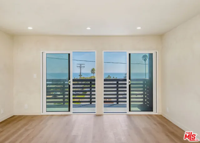 a view of a hallway with washer and dryer