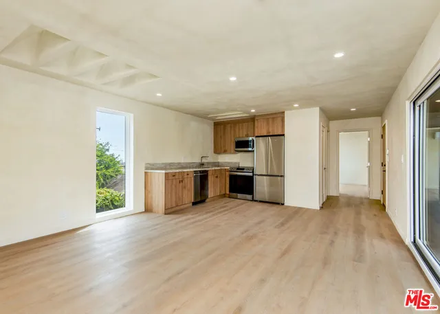 a view of balcony with wooden floor