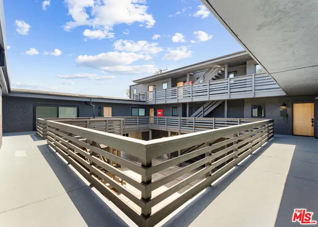a view of parking garage with cars