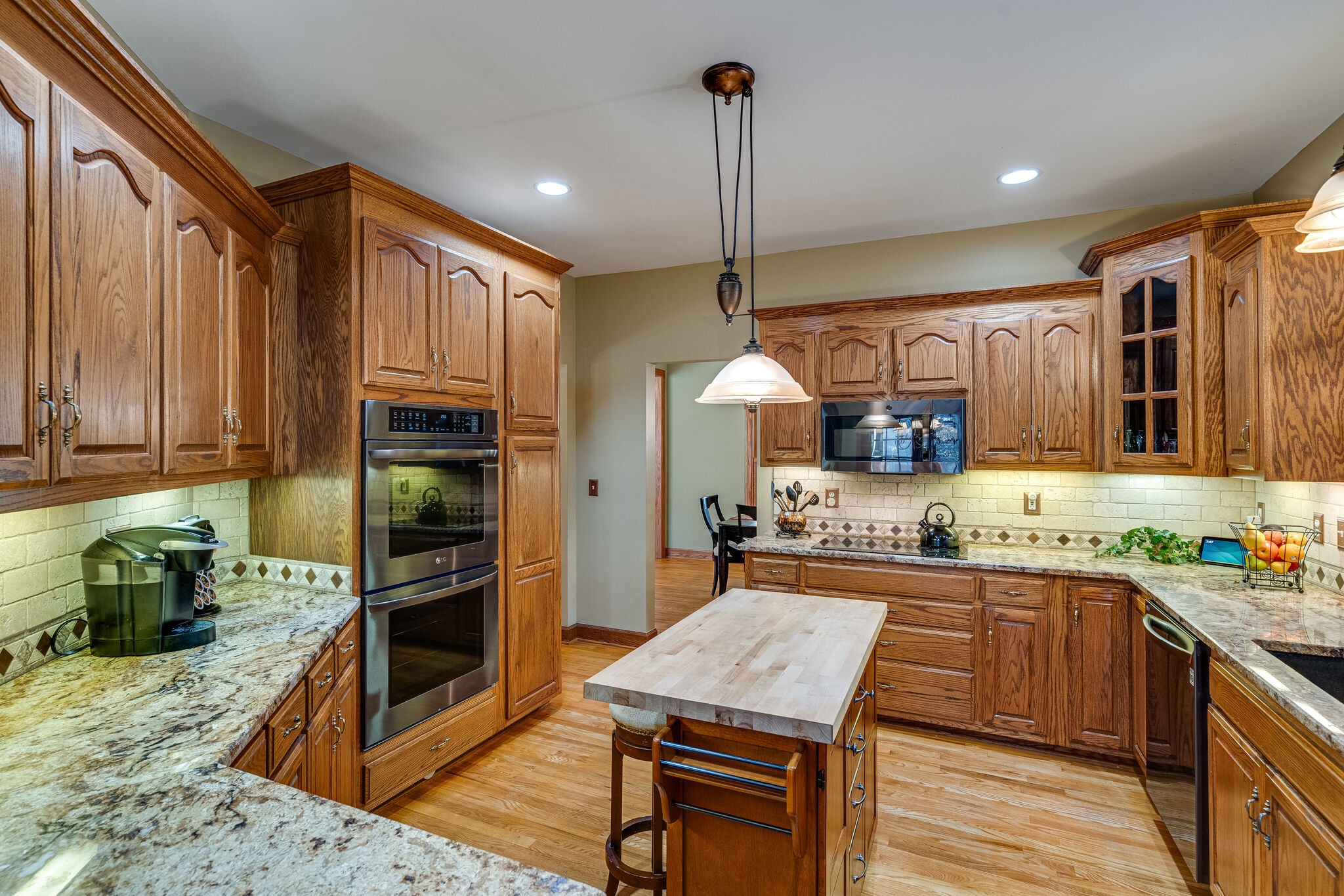 1823 Fortner Road Dickson, TN 37055 - Photo 11 of 55 a kitchen with a sink stove and wooden cabinets