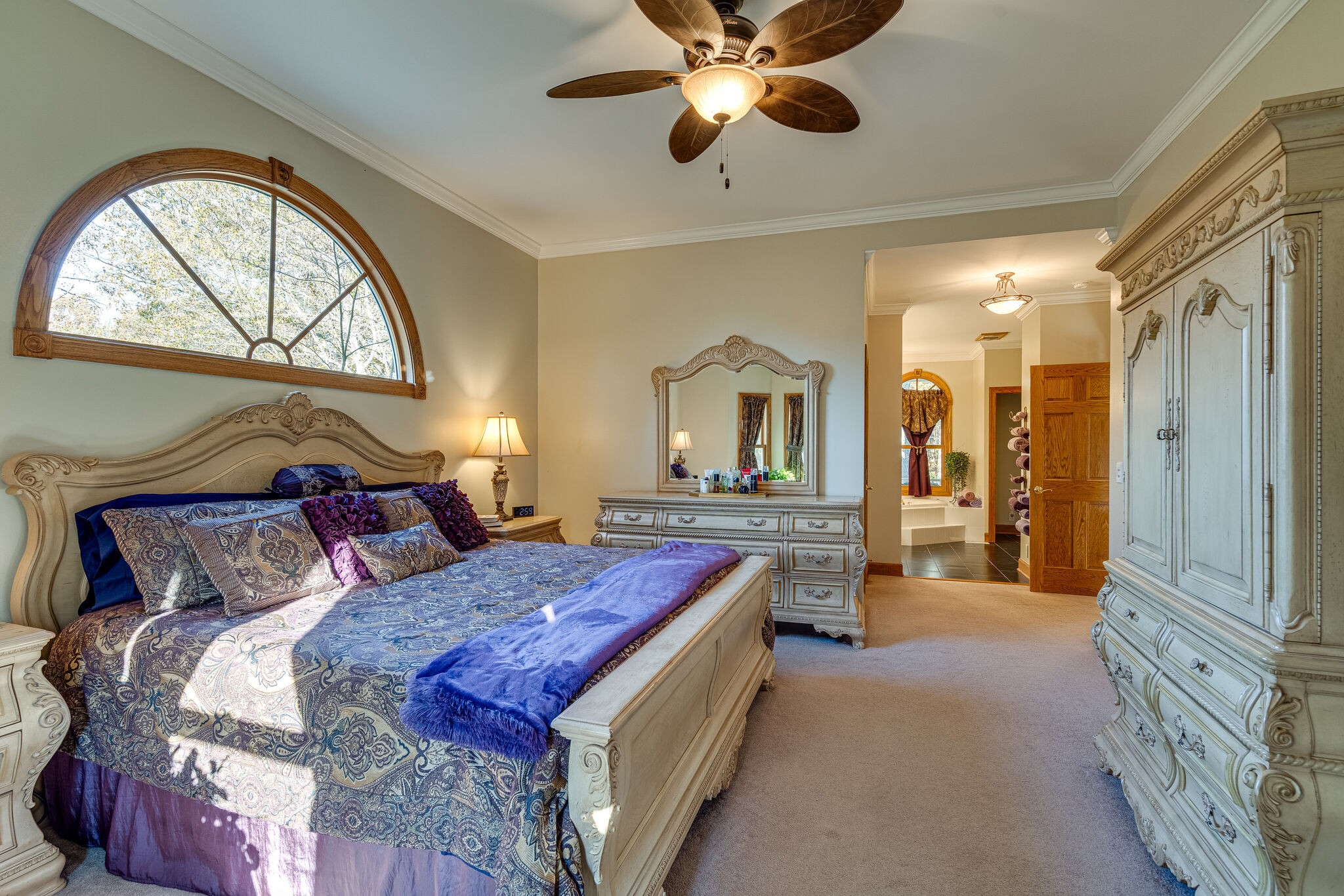 1823 Fortner Road Dickson, TN 37055 - Photo 15 of 55 a spacious bedroom with a bed and a chandelier