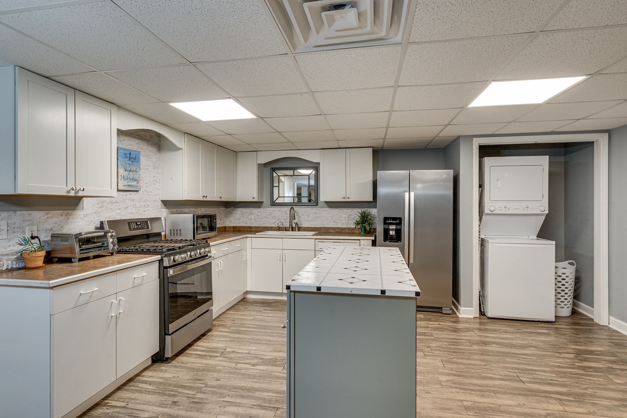 1823 Fortner Road Dickson, TN 37055 - Photo 28 of 55 a kitchen with granite countertop stainless steel appliances cabinets a sink and a wooden floor