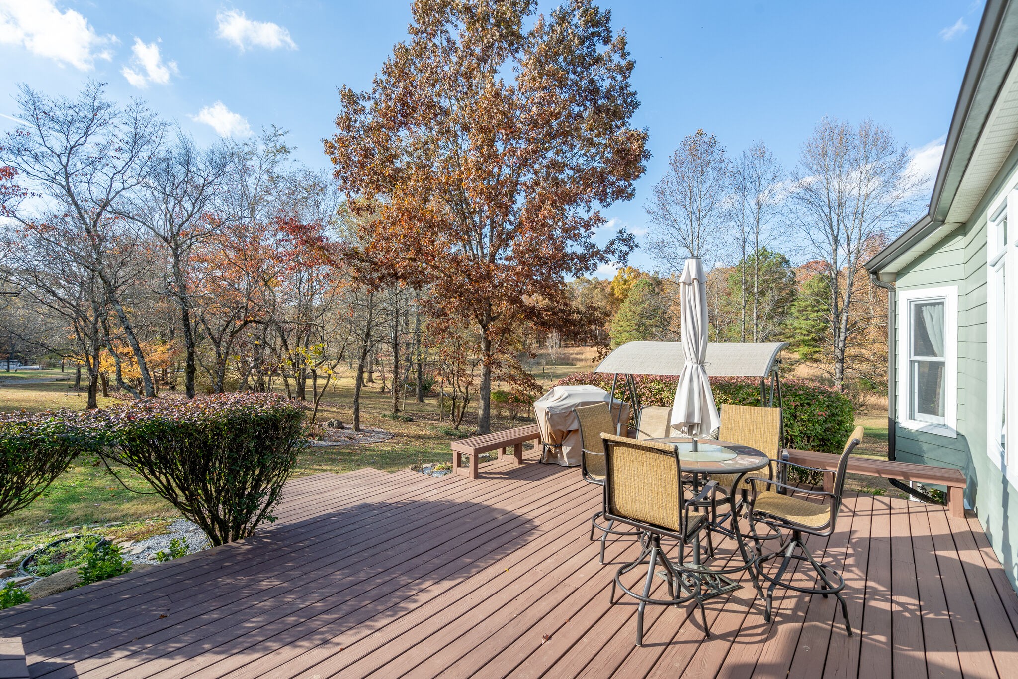 1823 Fortner Road Dickson, TN 37055 - Photo 36 of 55 a view of a patio with table and chairs and potted plants with wooden floor and fence