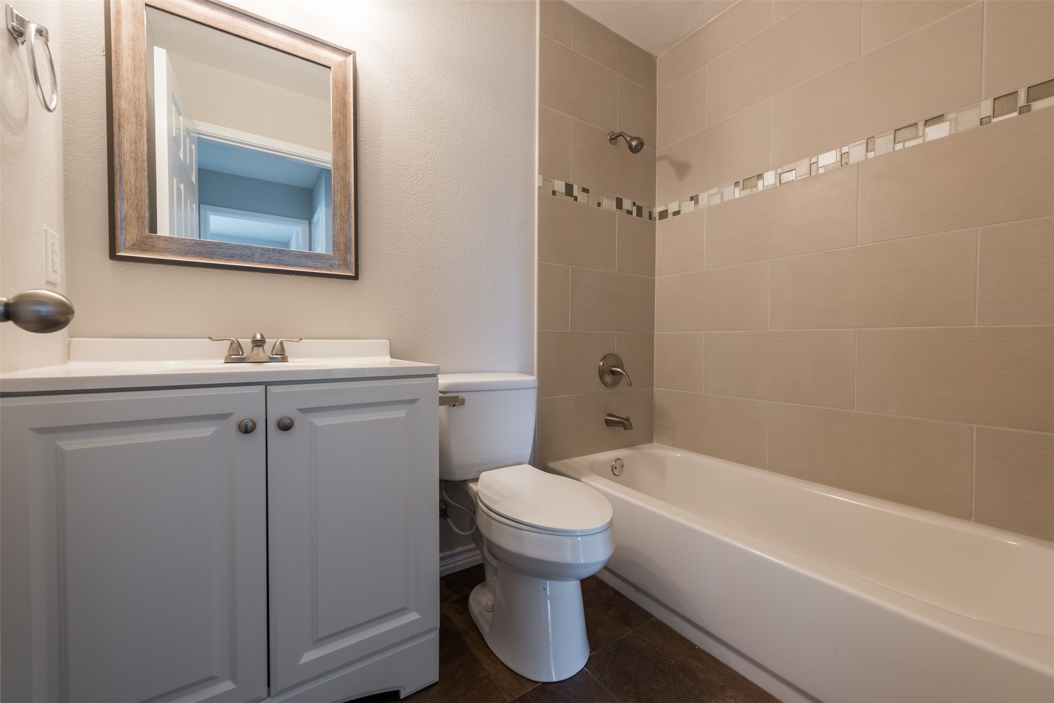 5703 Teri Road Austin, TX 78744 - Photo 14 of 16 a bathroom with a sink toilet and shower