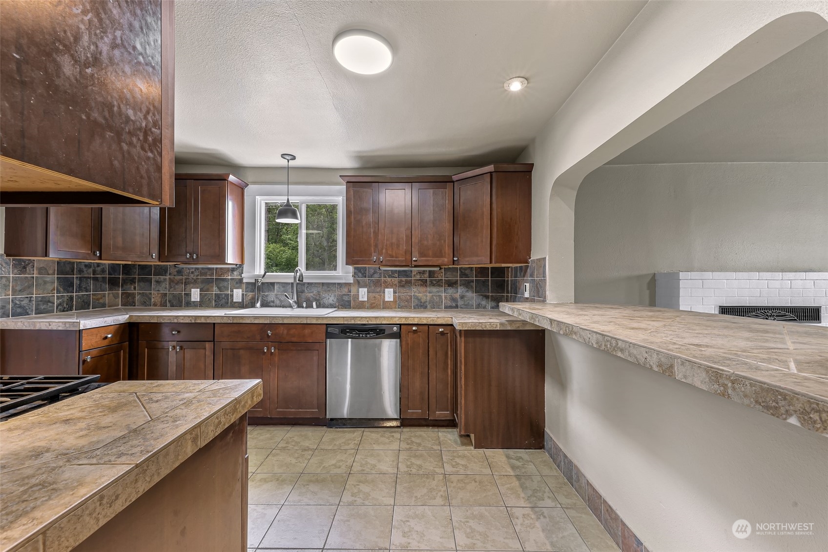 1102 Nevada Street Bellingham, WA 98229 - Photo 12 of 40 a kitchen with a sink stove and cabinets