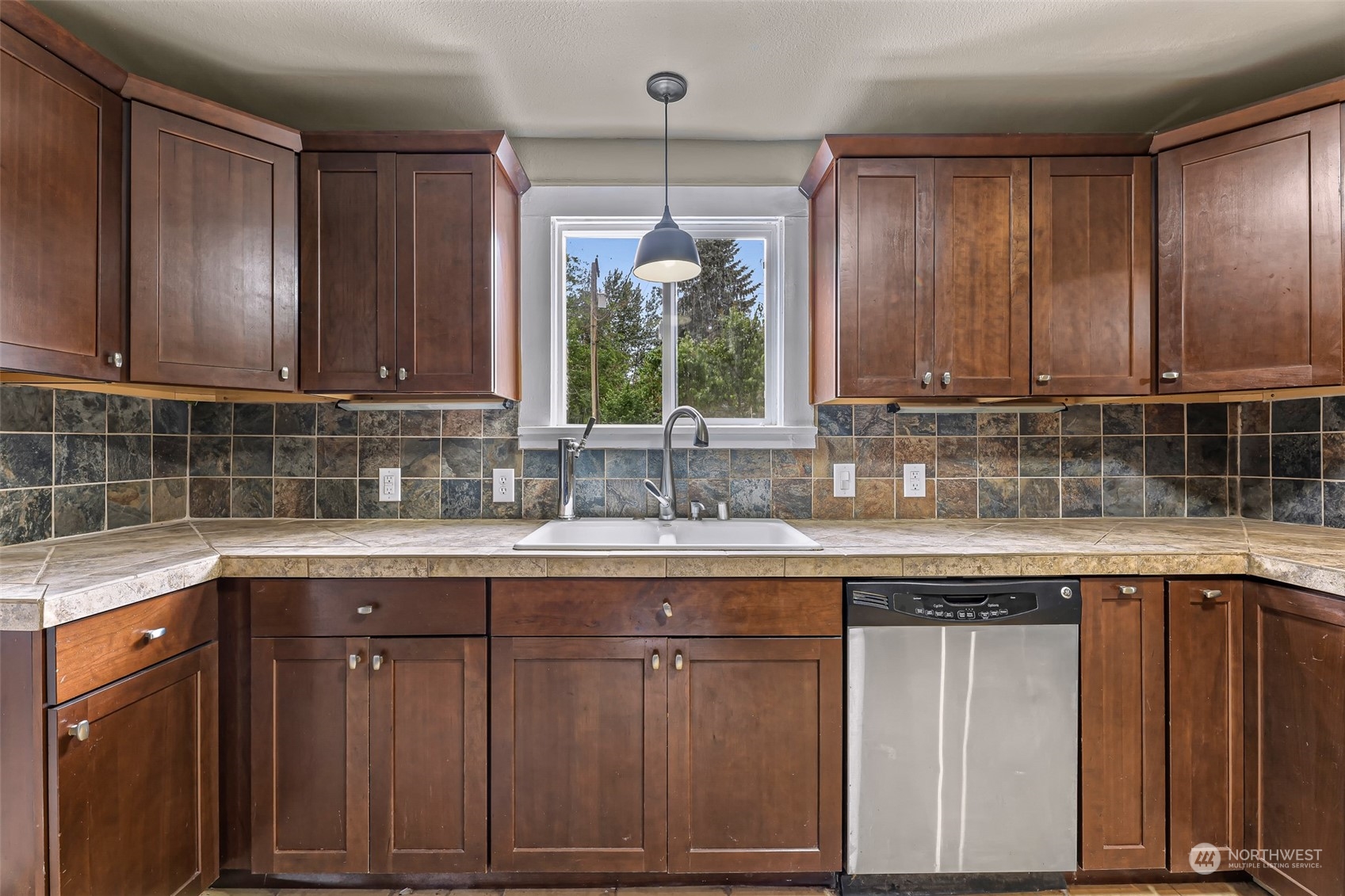 1102 Nevada Street Bellingham, WA 98229 - Photo 16 of 40 a kitchen with a sink cabinets and window