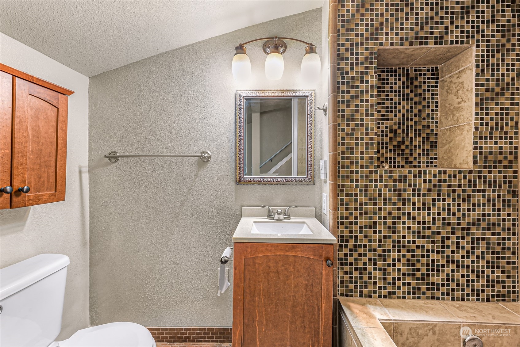 1102 Nevada Street Bellingham, WA 98229 - Photo 26 of 40 a bathroom with a sink a toilet and mirror