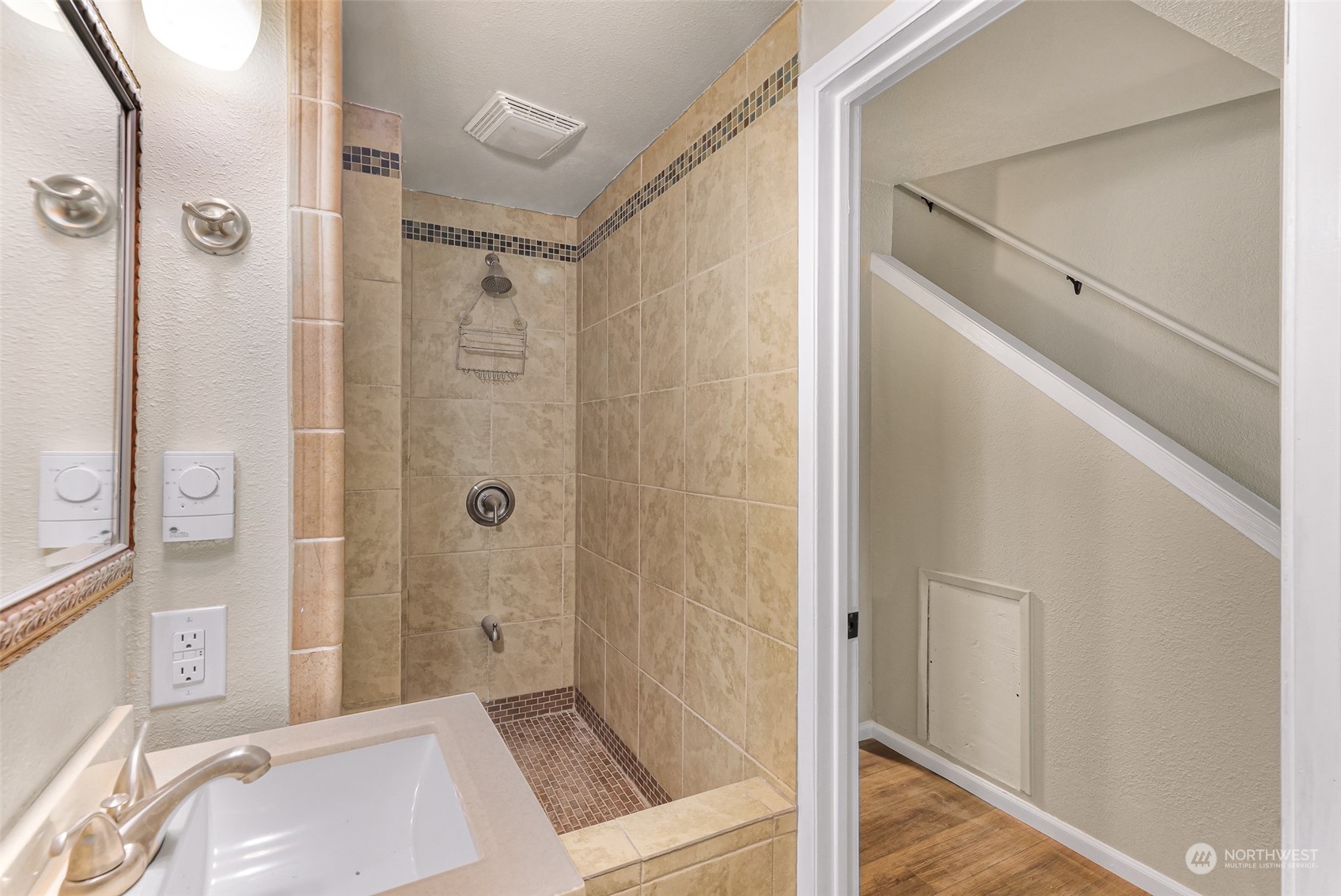 1102 Nevada Street Bellingham, WA 98229 - Photo 27 of 40 a bathroom with a shower and a sink