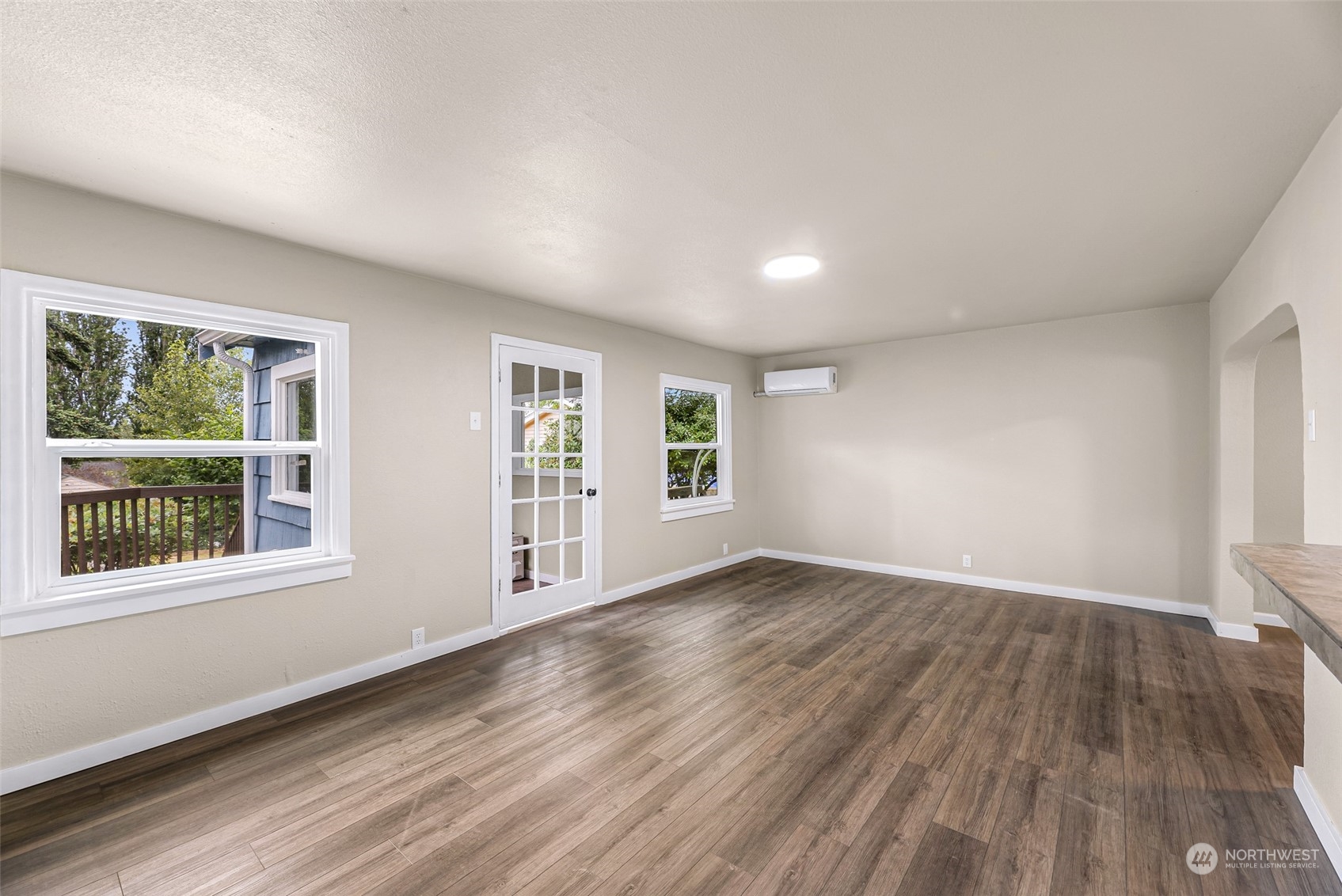 1102 Nevada Street Bellingham, WA 98229 - Photo 8 of 40 a view of an empty room with wooden floor and a window