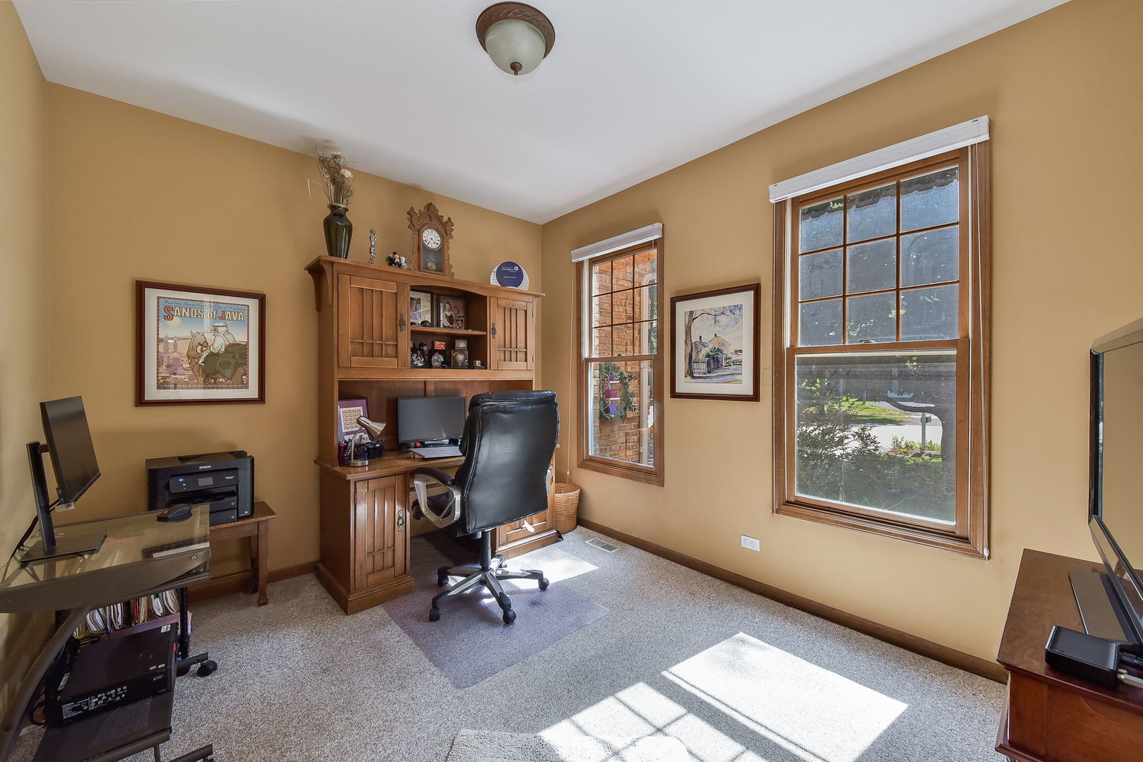 439 Lewis Road Geneva, IL 60134 - Photo 3 of 24 a view of a workspace with furniture and a window